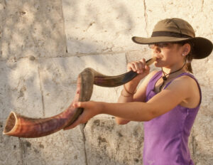 Jewish Women's Archive. "Girl Blowing Shofar at the Kotel."